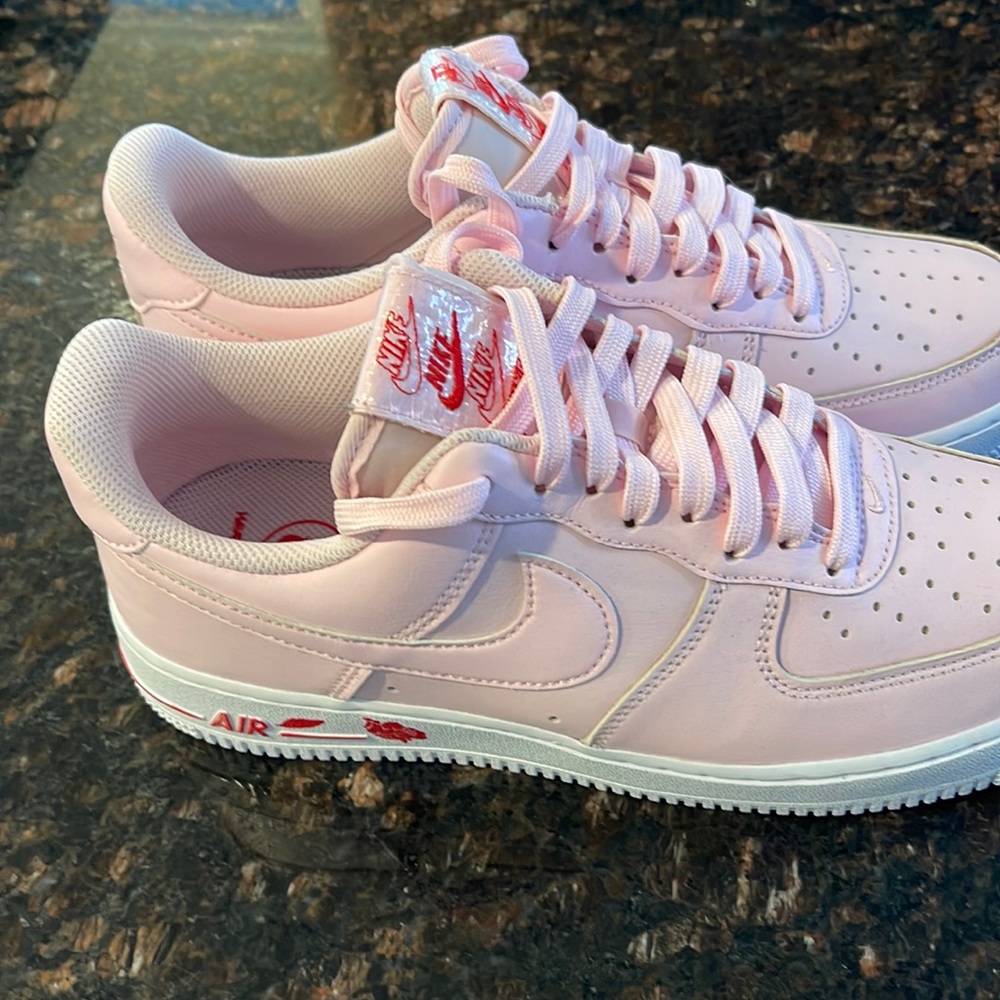 Never worn Nike Air-Force 1. Pink with rose design. Womens sz 9.5 Men’s size 8.